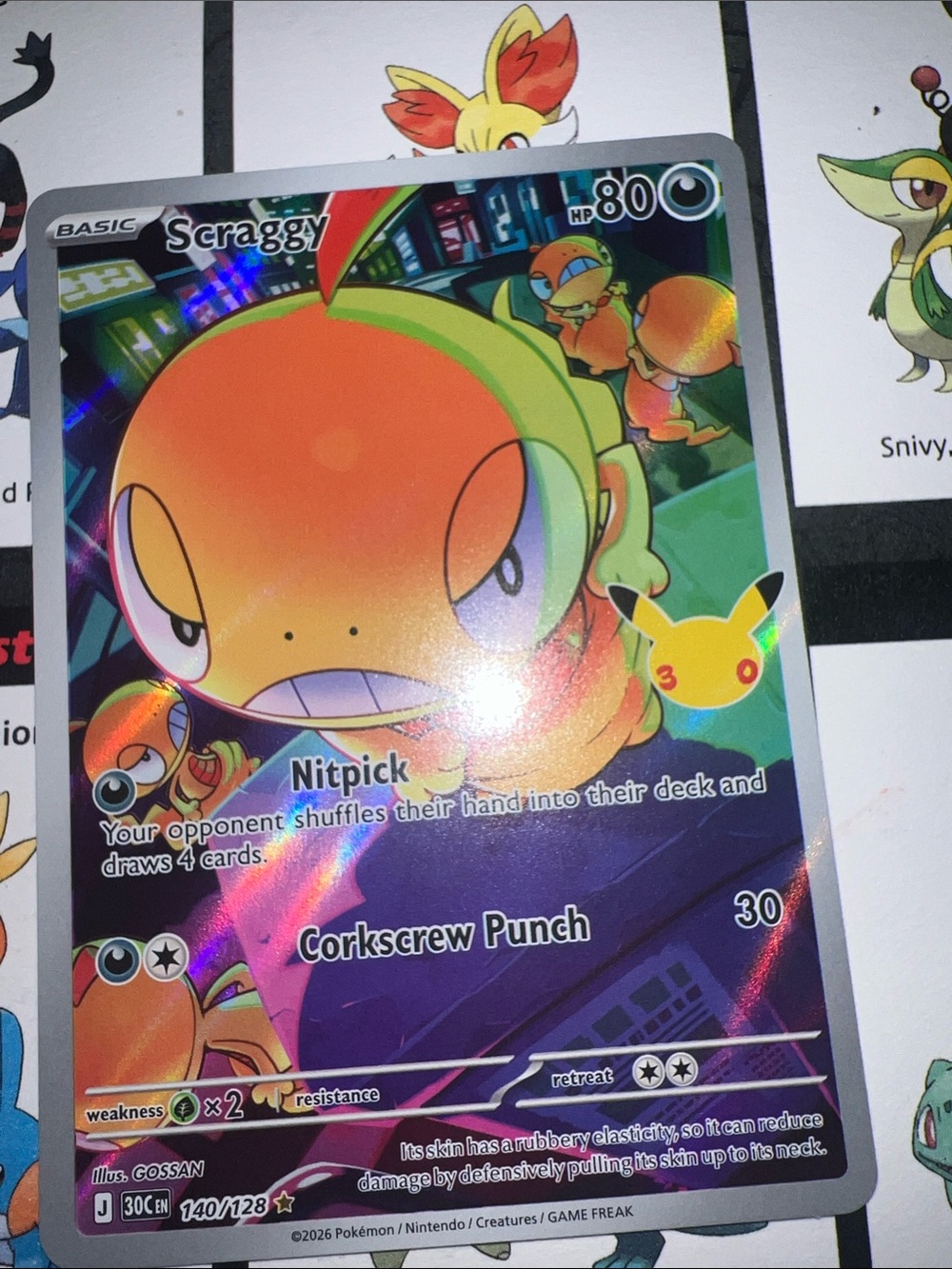 Pokemon Holofoil Scraggy Card - Orange & Green